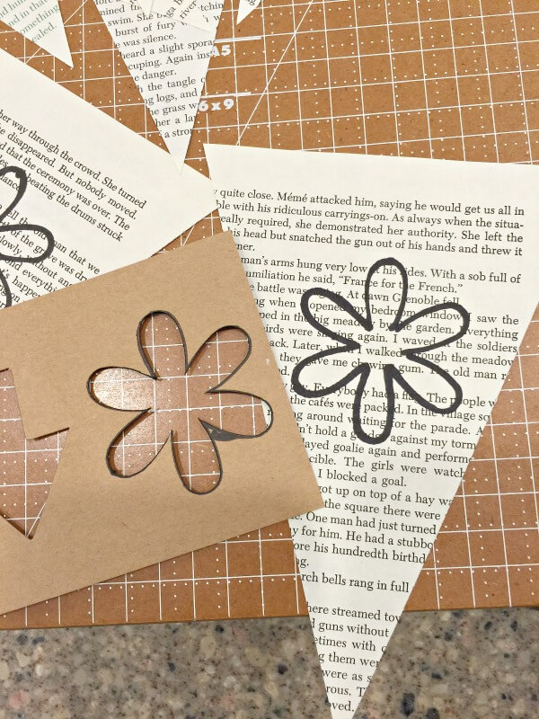Make this spring banner with book pages! Such a great idea! | Twelveonmain.com