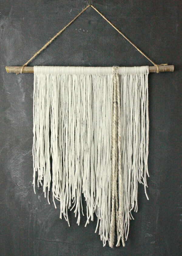 DIY yarn wall hanging. This is so easy to make, you might want to involve your kids....or not:) | Twelveonmain.com