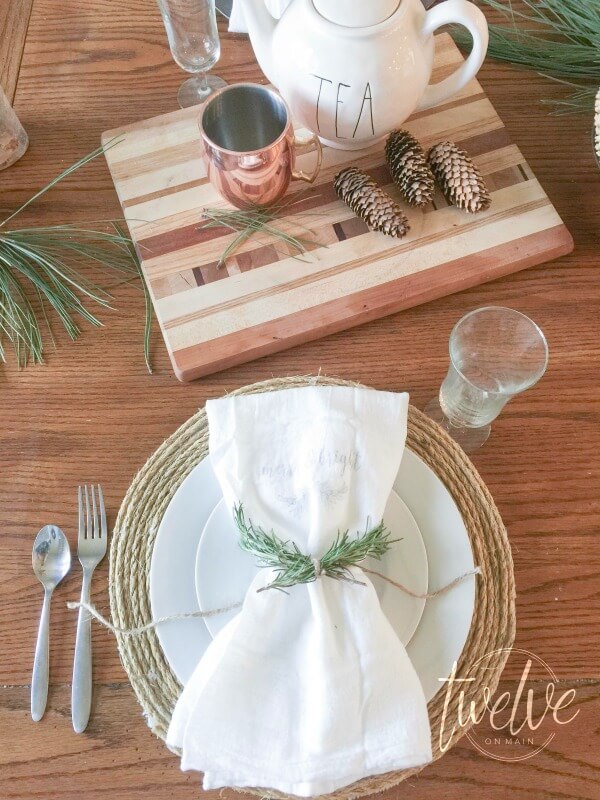 I love this farmhouse Christmas tablescape. Every detail is perfect! Check out the copper mugs!