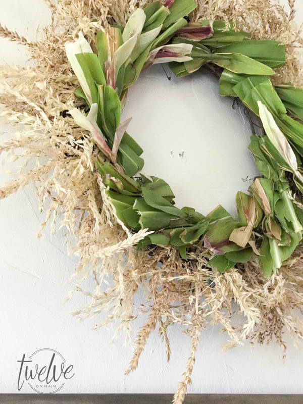 Do you love fall wreaths? Why not try this DIYD cornstalk fall wreath! It is such a cool wreath!