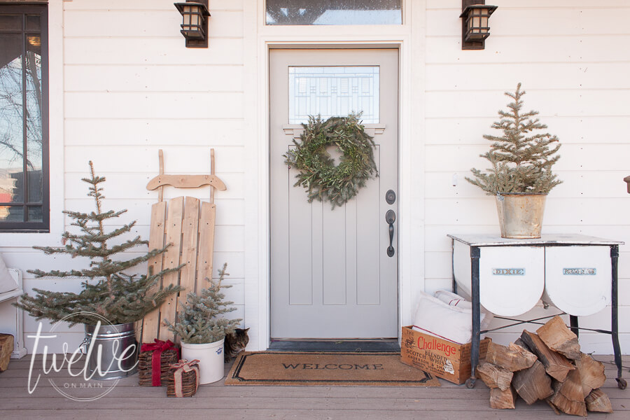 Fresh blue spruce trees, simple natural farmhouse Christmas decor, are all you need to create a beautiful farmhouse Christmas porch and entry.