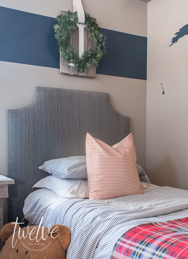 Want to decorate your bedroom for Christmas but don't know where to start? You only need a few inexpensive items to create the most cozy Christmas bedroom! Cozy boys bedroom decorated with farmhouse Christmas decor!