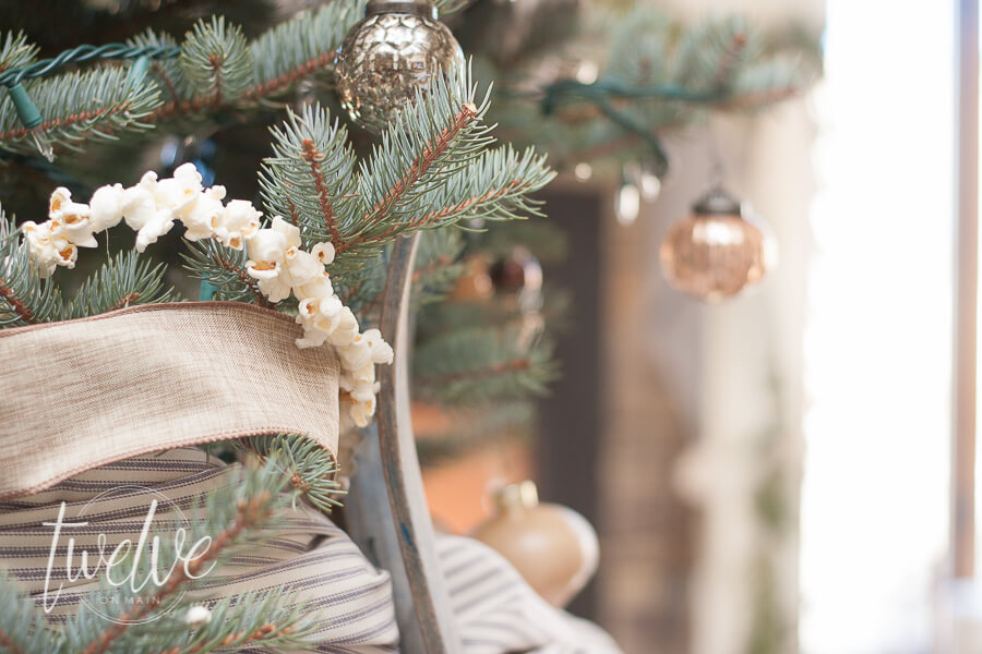Ticking stripe fabric, linen ribbon, popcorn garland, all thrown together to create an amazing farmhouse style Christmas tree.