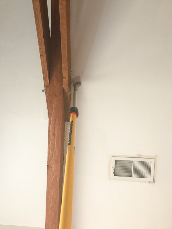 Duct tape a paint brush to the end of an extension pole to paint those hard to reach vaulted ceilings.
