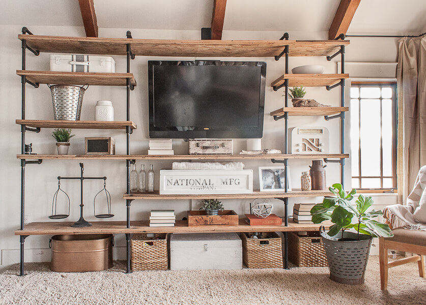 Industrial style shelves combined with farmhouse style living room accents create a cozy space to relax.