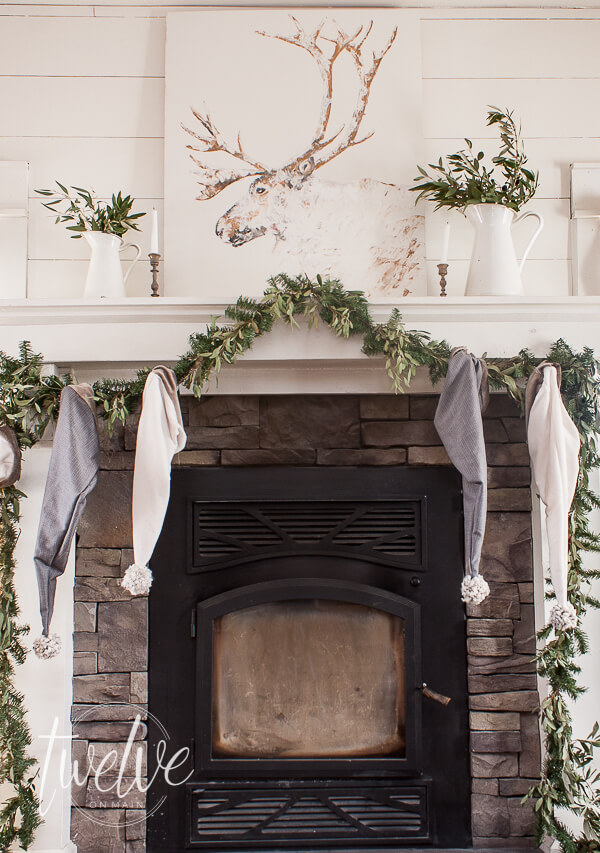 Winter caribou painting above the mantel. Love this farmhouse artwork for the winter