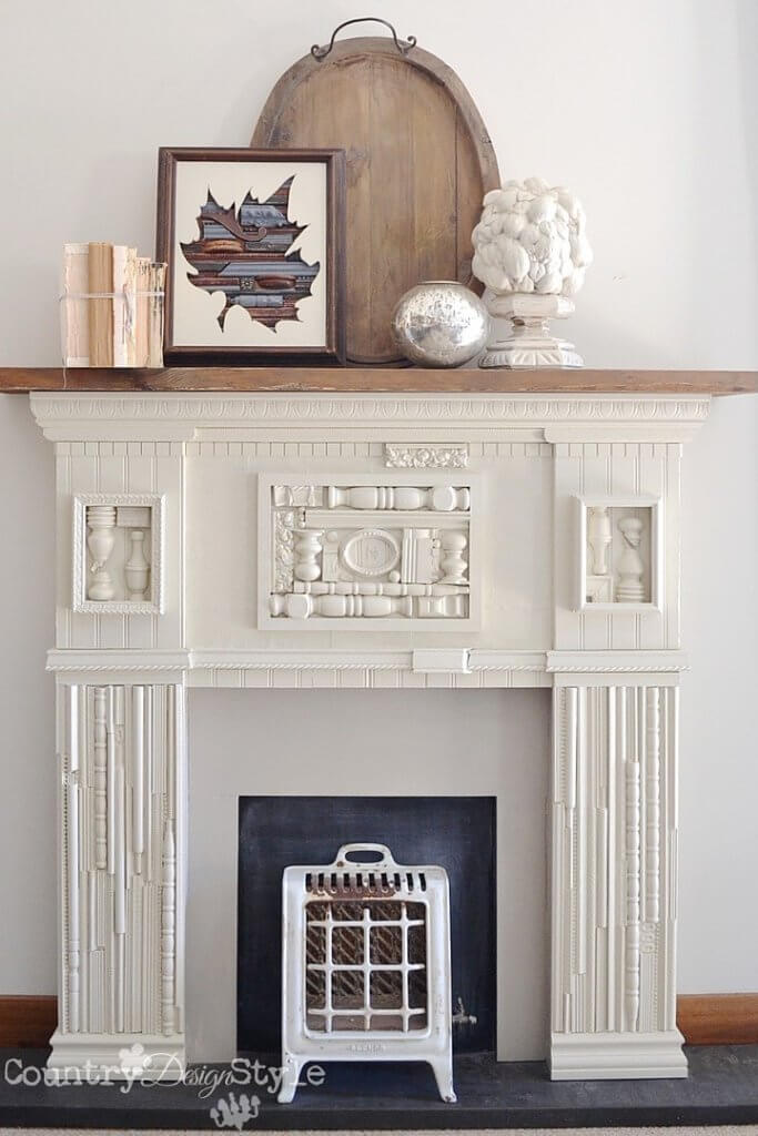 Incredible DIY faux fireplace with scrap wood accents. SO pretty!