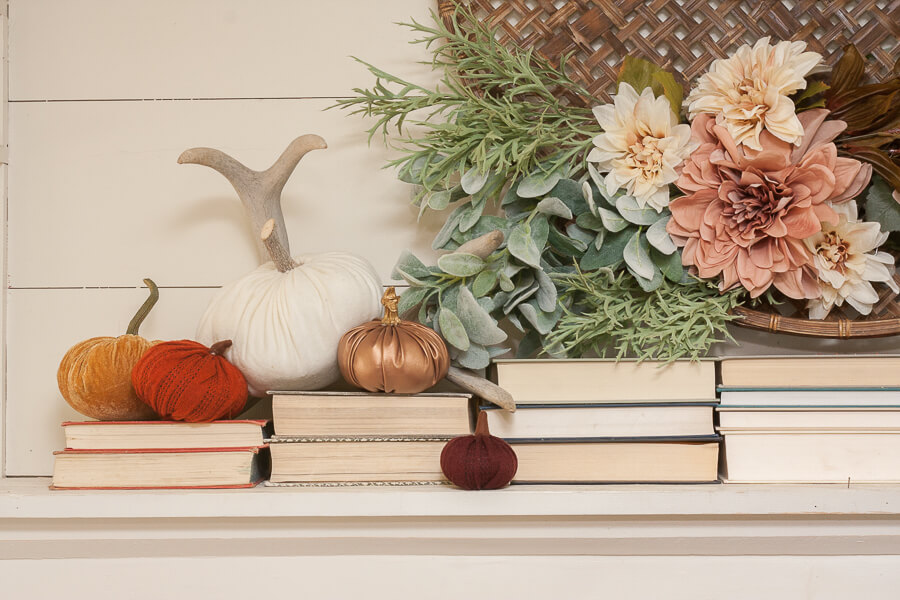 Gosh I love the blush and orange colors of these pumpkins! They look so perfect with the flowers and books on this mantel!