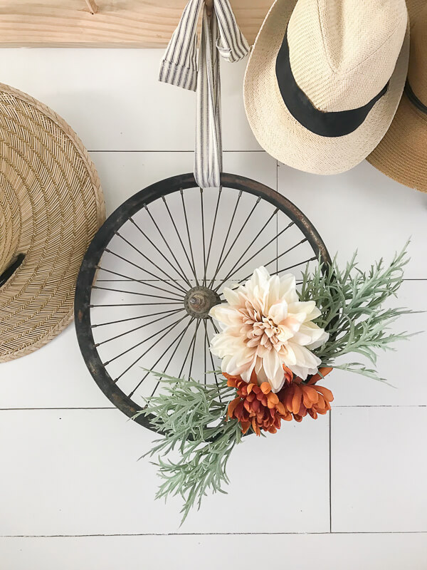 What a super cute and stylish upcycled bicycle wheel wreath