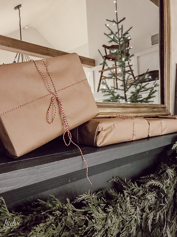 Farmhouse Christmas bedroom decor that is easy for anyone!  Simple touches like a real tree, and real cedar garland adds the perfect touch to this space.