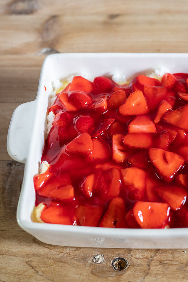 This is the perfect summertime strawberry dessert! Make this treat for barbecues, parties, and just for an everyday treat! With angel food cake, pudding, and strawberries, you can't go wrong! The perfect easy strawberry trifle recipe!