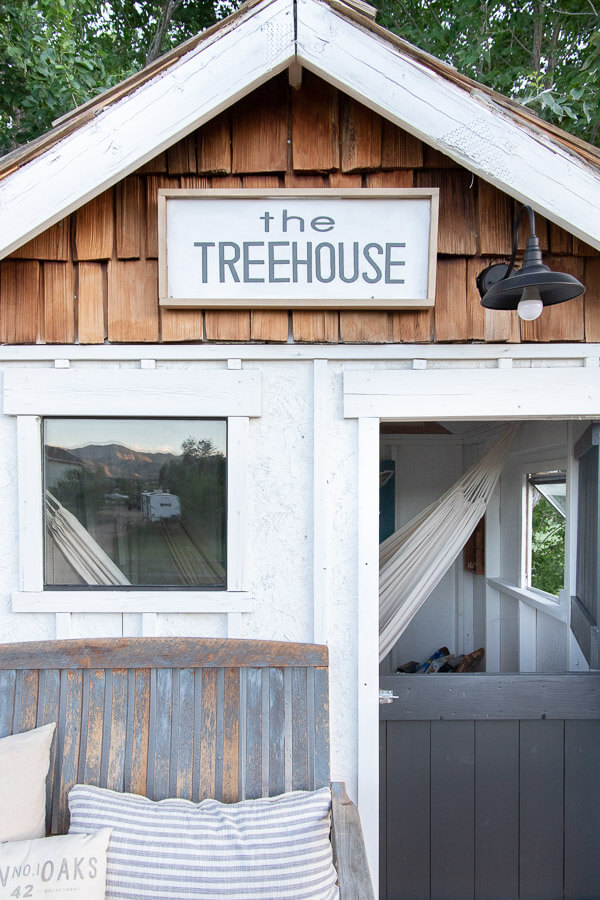 Get inspired with this amazing treehouse design! Love the hammocks and the front porch!