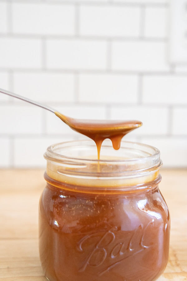 Store your homemade caramel sauce in a mason jar in the fridge.  It will last 2 weeks! It is delicious and so easy to make!