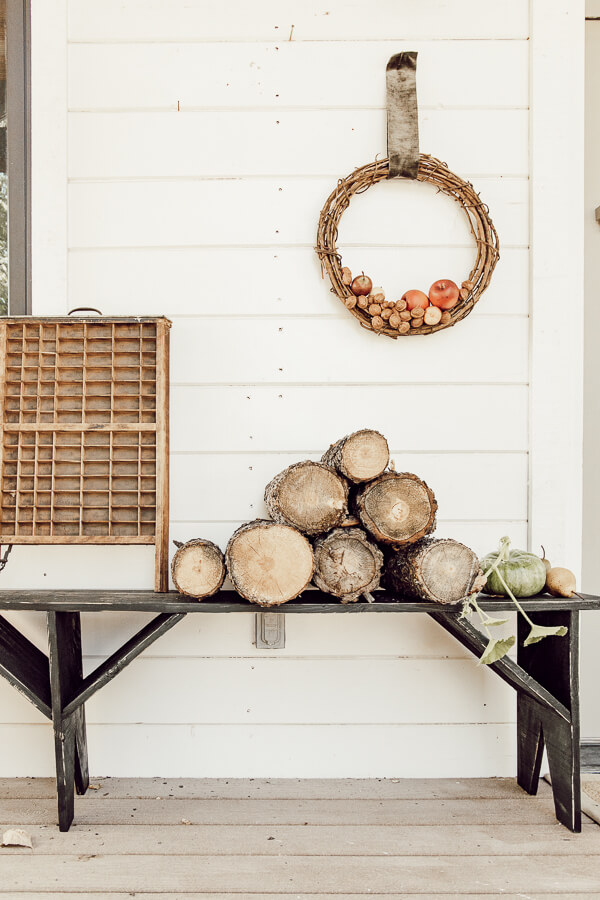 This hand built primitive style black bench is the focal point of my fall porch decor. It goes perfectly with my handmade apple and walnut wreaths!