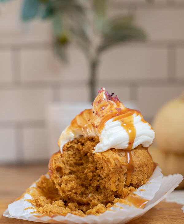 Utterly decadent fall inspired pumpkin cupcakes topped with cream cheese frosting, caramel and sea salt. It has all the flavors of fall!