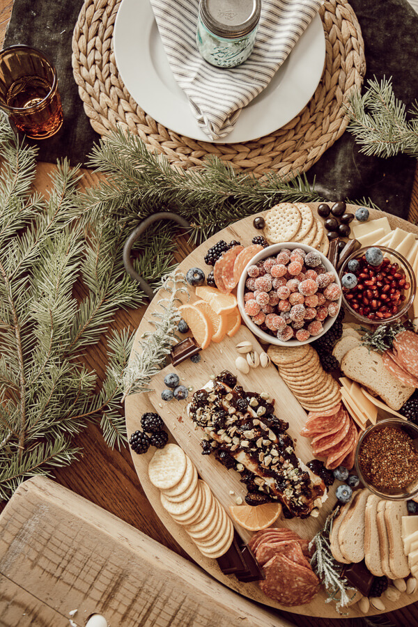 How to make a gorgeous holiday charcuterie board that is delicious and full of texture and style. Take a simple meat and cheese plate and turn it on its head!