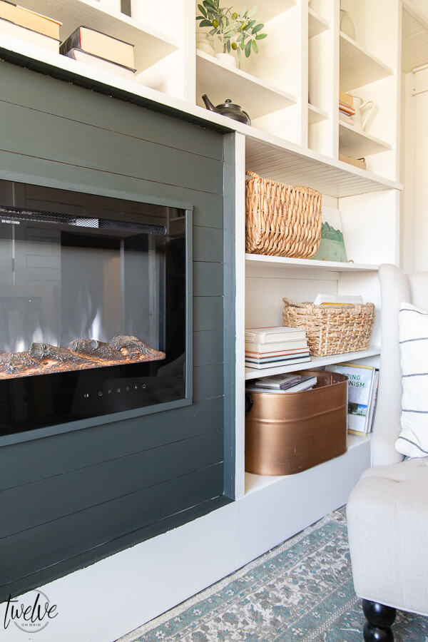 How I used my Wagner paint sprayer to makeover my new bookshelves and how we added a built in electric fireplace to the space in only a couple hours on a Saturday!