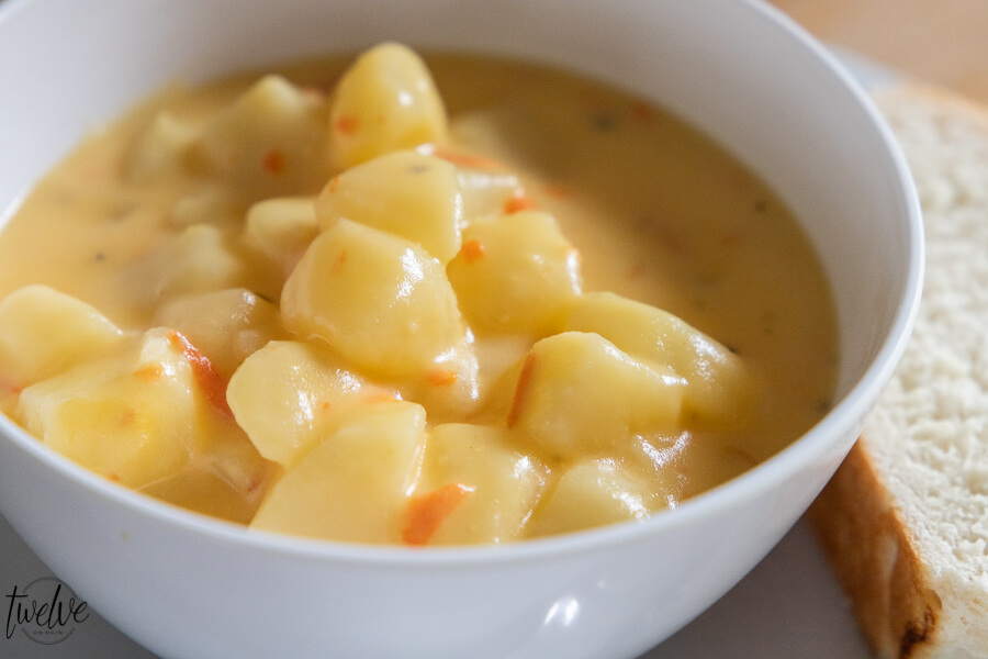 Delicious hearty creamy potato soup with cheese and carrots