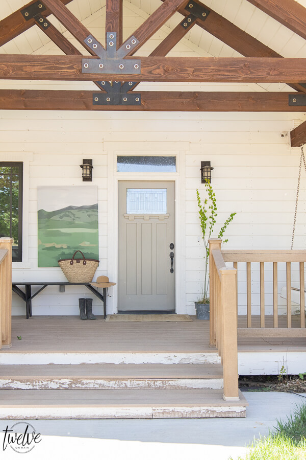 How to use artwork in your front porch decor! Get tons of front porch decor tips and ideas. Decorating does not have to be expensive or complicated!
