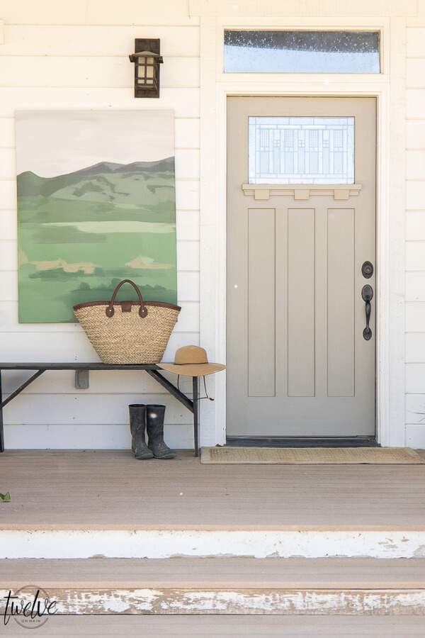 How to use artwork in your front porch decor! Get tons of front porch decor tips and ideas. Decorating does not have to be expensive or complicated!