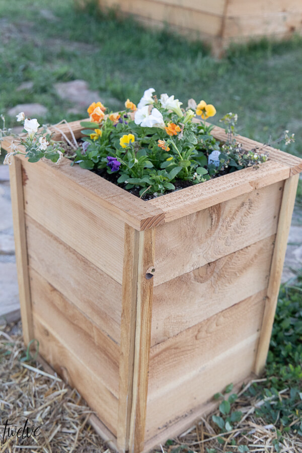 How to make super easy, inexpensive and cute cedar planter boxes to plant flowers, herbs, or evergreen plants. These are so easy, I did them all by myself!