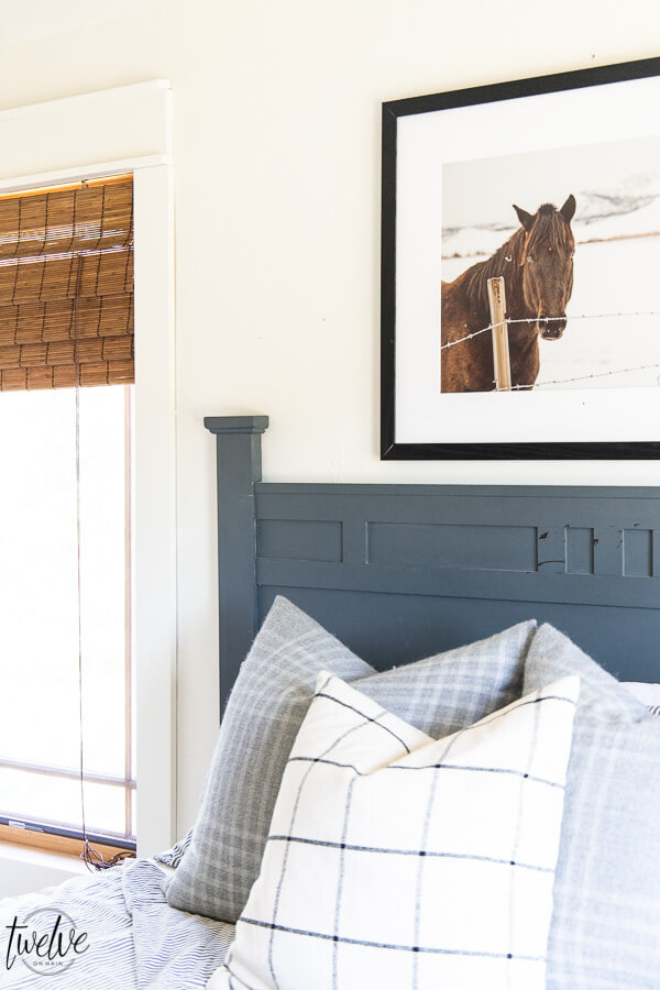 Teenage boys bedroom complete with simple white walls using Benjamin Moore Dove White, ticking strip bedding, grey plaid pillows and some horse photography to round it out.  