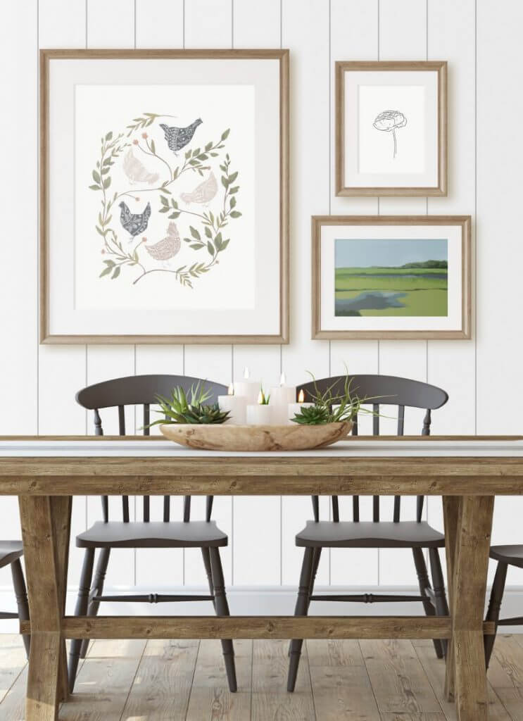 Farmhouse dining table with black chairs and a farmhouse style gallery wall with my FREE chicken printable!