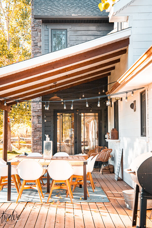 Fall dining on the back porch, with a new exterior paint job. Gorgeous contrasting paint colors, complete with copper gutters, Benjamin Moore White Dove and a custom paint color called Dark Ash.
