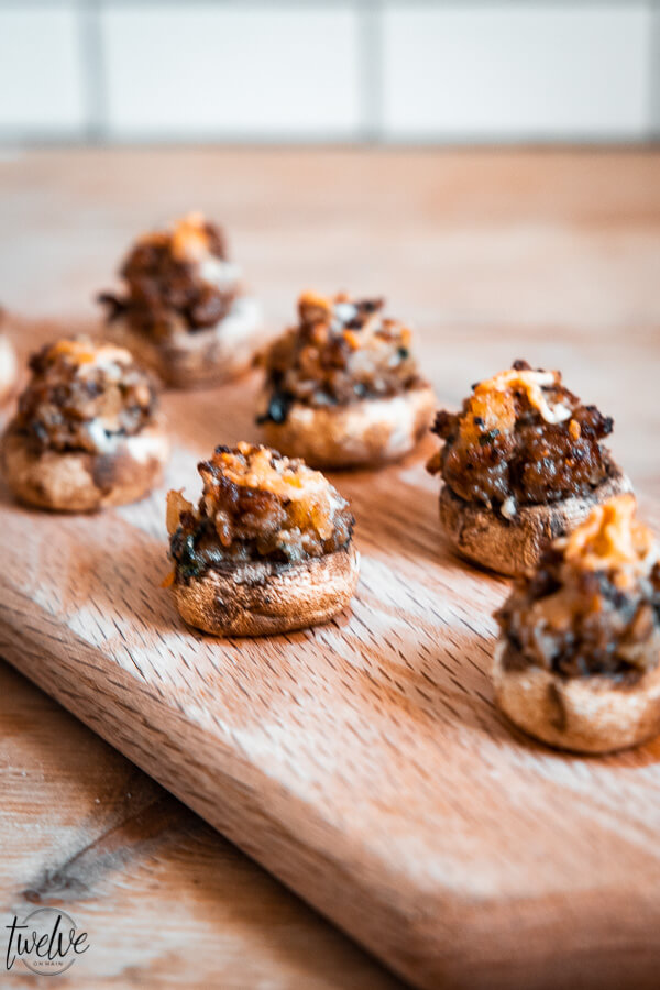 Make these easy and flavorful stuffed mushrooms for your next party or for your family! They are earthy, flavorful and so easy to make! These combine my favorites, sausage, thyme, sage, goat cheese and more