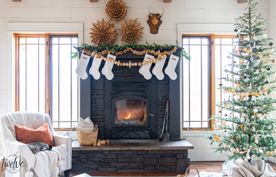 How to paint a stone fireplace with a paint sprayer and give it an updated and modern look in no time! See how I gave my stacked stone fireplace a complete facelift with just a coat of paint.