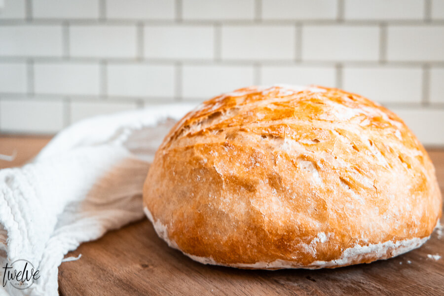 How to make easy no knead bread in the dutch oven or on a sheet pan! This takes 5 minutes to prepare and you can set it and forget it until you are ready to bake it!  Everyone will think you are a bread genius!  Click here!