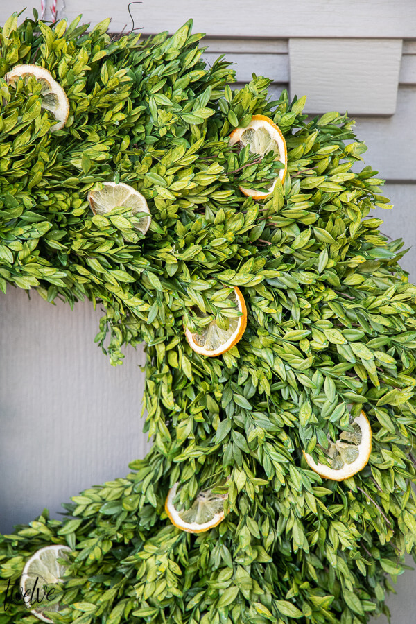 How to make a stylish boxwood and lemon summer wreath perfect for a front door or entry way.  It is easy to create and inexpensive!