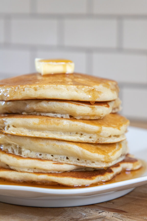How to make amazing overnight sourdough pancakes that are good for you.  They have all those good benefits from long ferment sourdough because they get to sit overnight! When you wake up its as easy as stirring the batter up, and cooking up some amazing, flavorful, light and fluffy sourdough pancakes.