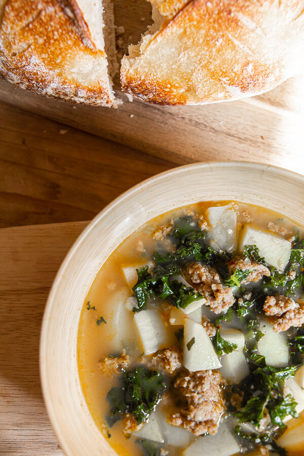 This sausage, kale and potato sup is made even better using spicy sausage! Try this spicy sausage and potato soup today! The flavor is out of this world! It is perfect for a rainy day or a busy weeknight dinner!