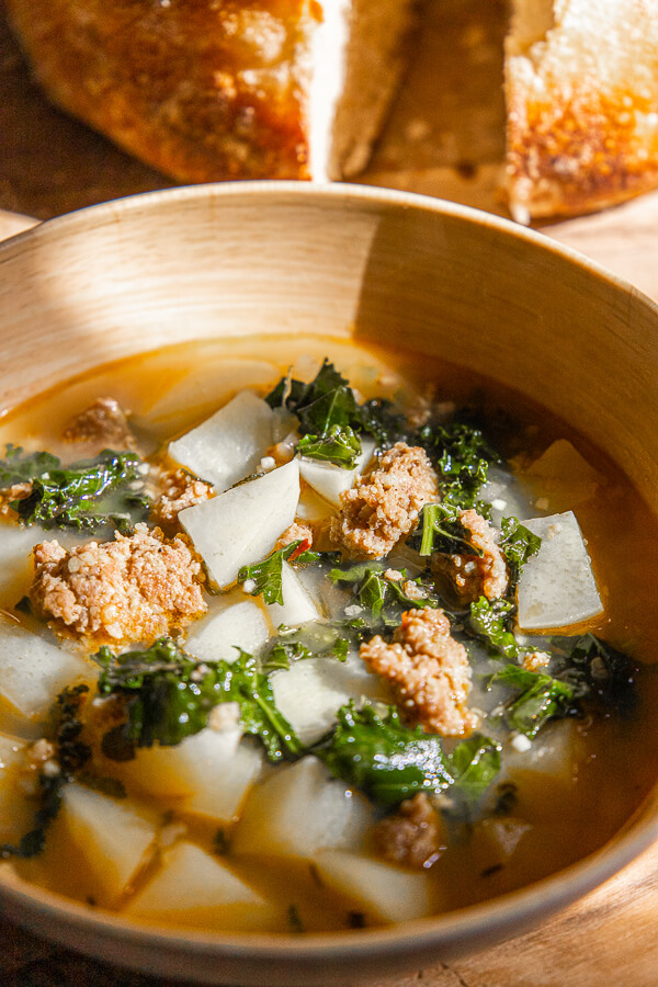 This sausage, kale and potato sup is made even better using spicy sausage! Try this spicy sausage and potato soup today! The flavor is out of this world! It is perfect for a rainy day or a busy weeknight dinner!