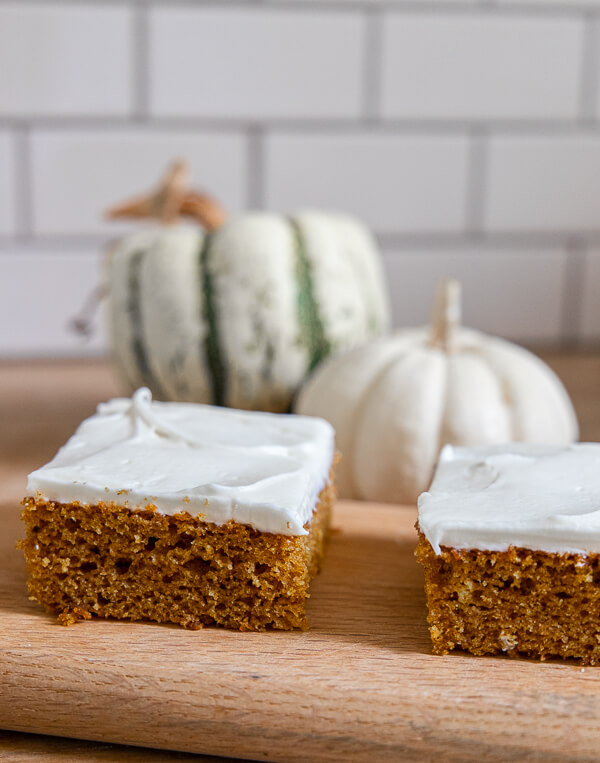 How to make this easy pumpkin sheet cake in under 1 hour! It tastes amazing, it perfect for a big crowd and is the perfect treat for fall.