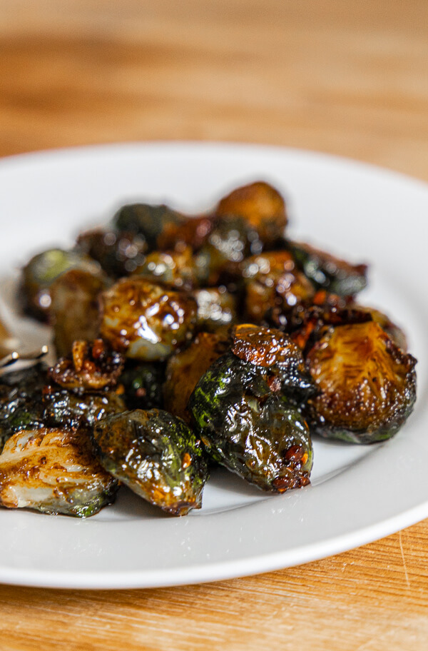 Amazingly flavorful and healthy air fryer roasted maple and balsamic brussel sprouts. Make these for your next dinner or Thanksgiving!