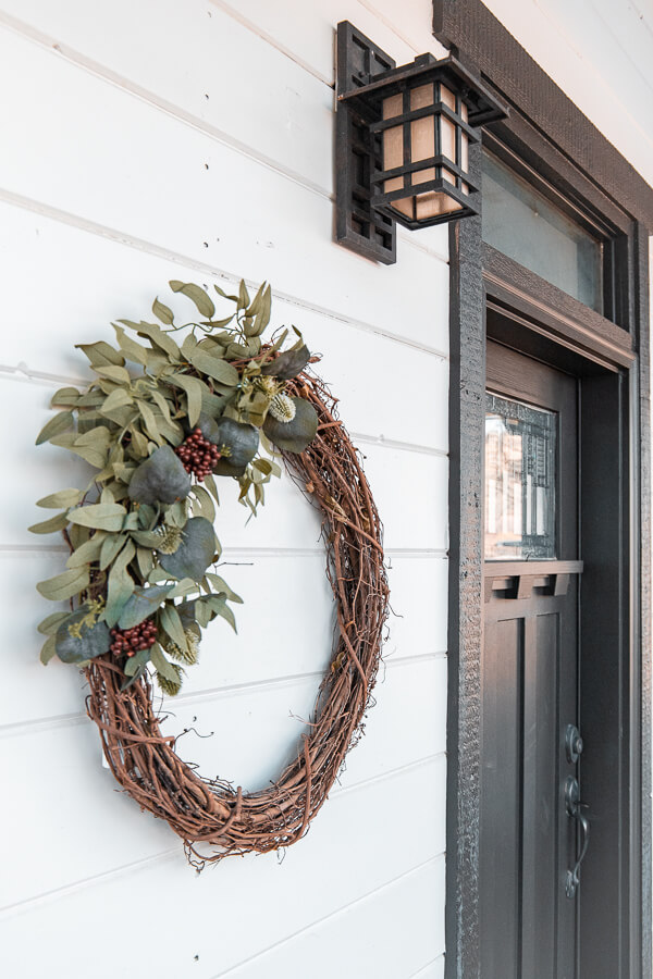 Make yourself a gorgeous and affordable DIY winter wreath that will brighten up your home, and make those long winter months more bright.