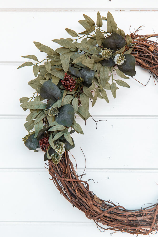 Make yourself a gorgeous and affordable DIY winter wreath that will brighten up your home, and make those long winter months more bright.