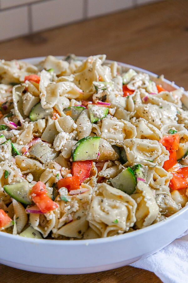 I love this tortellini pasta salad. The fresh ingredients combined with the creamy pasta makes for a killer as well as easy side dish. The dressing is one that I love to use on regular salads as well. This is a cold pasta salad, full of delicious flavor. It is a great side dish for hamburgers, grilled chicken and more. Its one of the best things I make! The whole family loves it. Make it today!