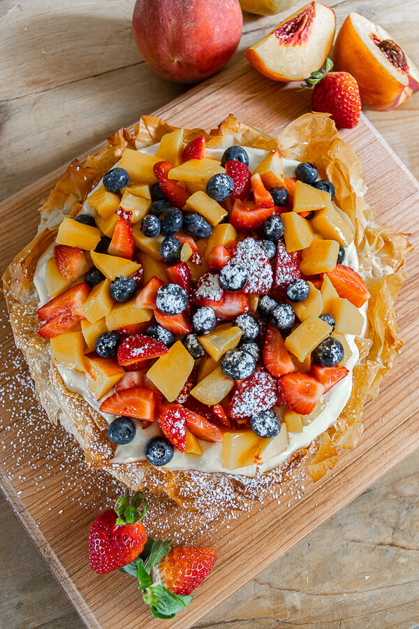 Make this easy simple summer fruit crostata with lemon cream cheese filling! This is refreshing, flavorful and so easy to make. I love a good fruit dessert, and this one takes the cake! You can change the fruit up depending on what is in season!