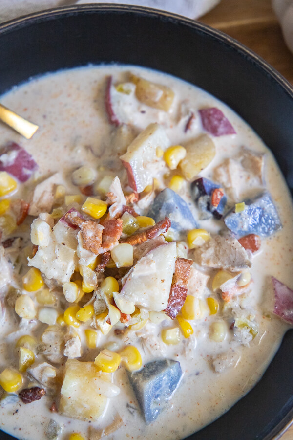 Make this hearty chicken corn chowder, full of corn, potatoes, bacon, herbs and more. This is full of flavor and affordable to make!