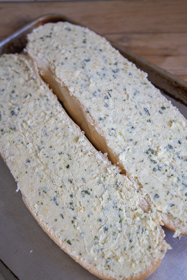 The best garlic bread recipe ever! This is the easiest and most flavorful garlic bread recipe made with fresh garlic, fresh basil, parmesan and butter!