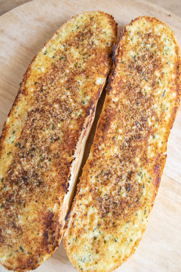 The best garlic bread recipe ever! This is the easiest and most flavorful garlic bread recipe made with fresh garlic, fresh basil, parmesan and butter!