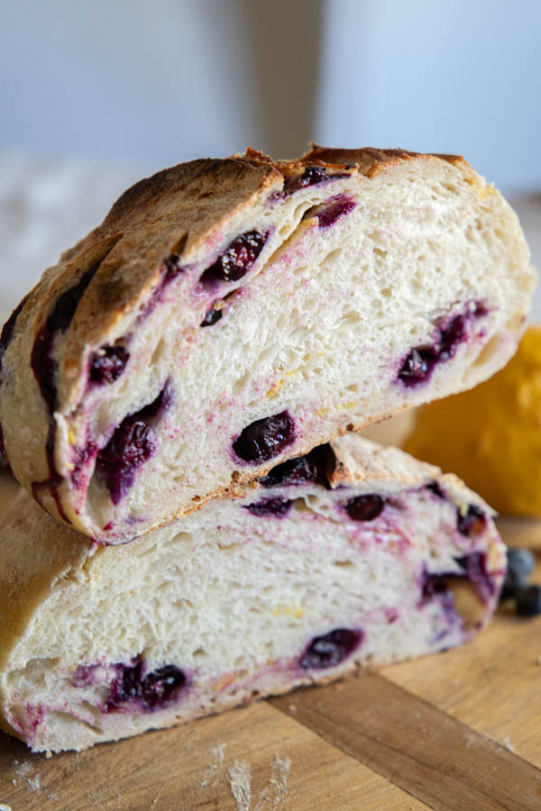 Make this amazing easy lemon blueberry sourdough bread! Its an easy step by step recipe sharing how to add the inclusions easily. The loaf tastes sweet, lemony with that subtle blueberry flavor!