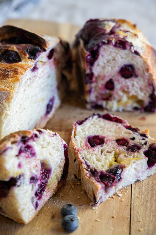 Make this amazing easy lemon blueberry sourdough bread! Its an easy step by step recipe sharing how to add the inclusions easily. The loaf tastes sweet, lemony with that subtle blueberry flavor!