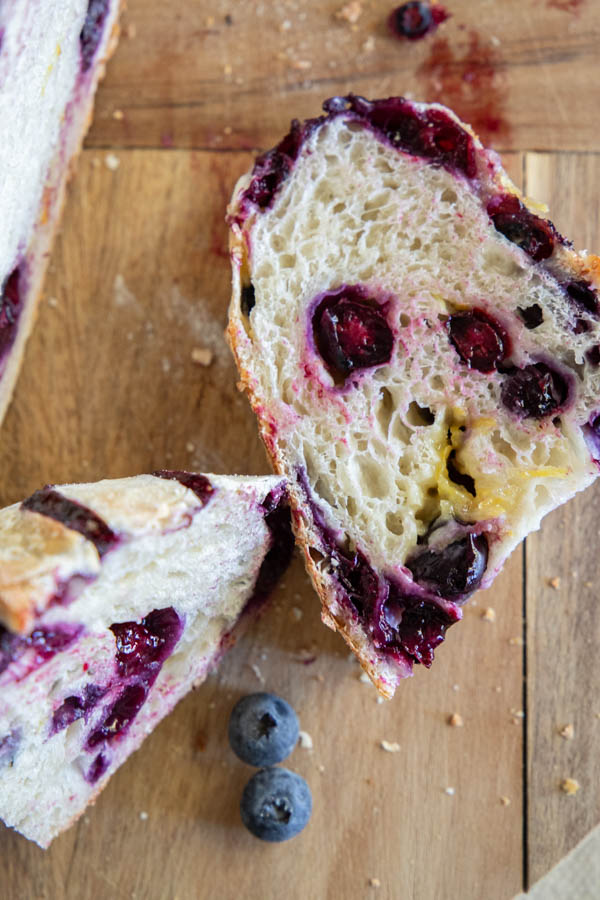 Make this amazing easy lemon blueberry sourdough bread! Its an easy step by step recipe sharing how to add the inclusions easily. The loaf tastes sweet, lemony with that subtle blueberry flavor!