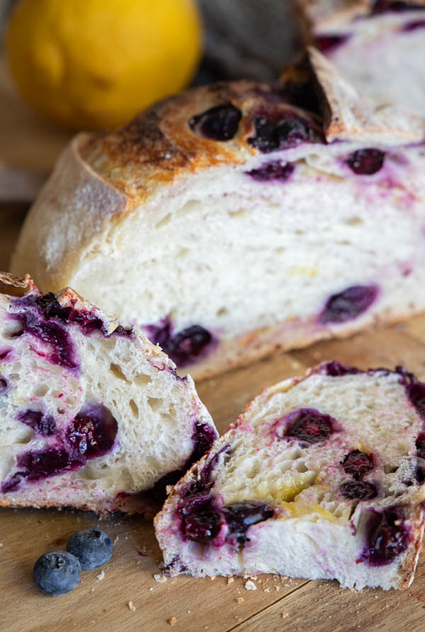 Make this amazing easy lemon blueberry sourdough bread! Its an easy step by step recipe sharing how to add the inclusions easily. The loaf tastes sweet, lemony with that subtle blueberry flavor!